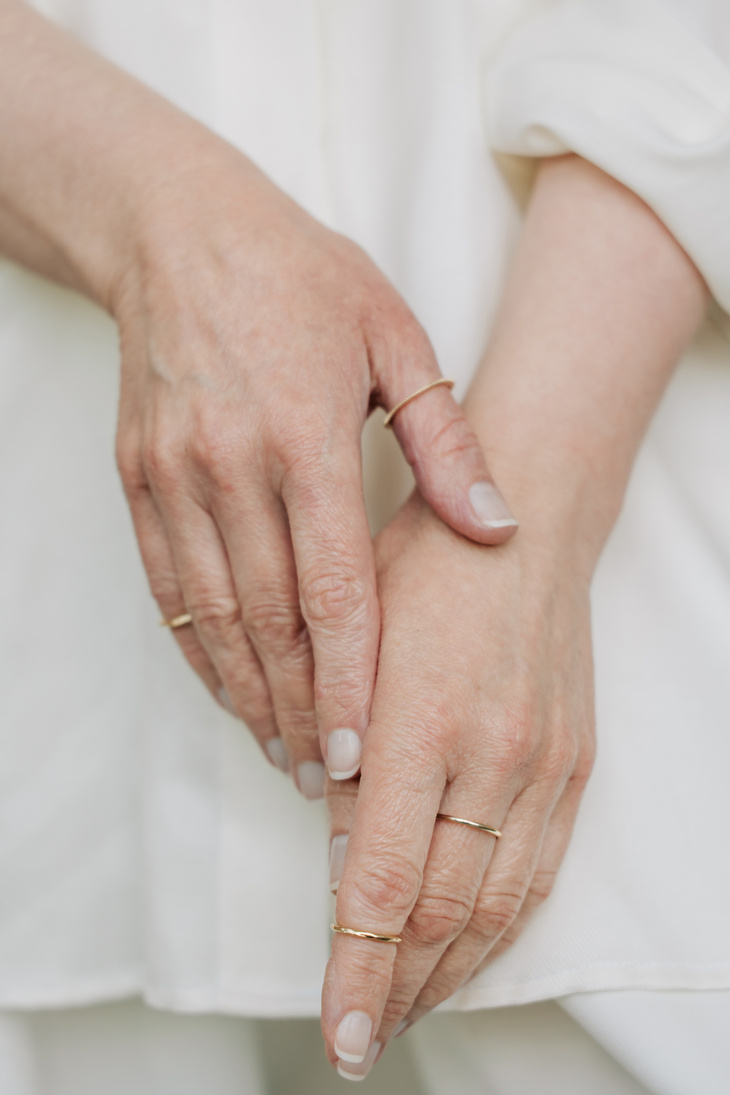 Mature Woman's Hands with Gold Rings